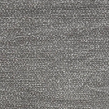 Detaljbild av möbeltyget Klint i grå nyans med tydlig boucléstruktur och fast väv, ett slitstarkt tyg för stoppade möbler och sänggavlar.