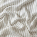 Skirt linnetyg Lotta i 100 % linne, draperat för att visa tygfall, mjukhet och levande linnefiber i naturliga nyanser.