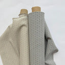 Grå och beige varianter av möbeltyget Saga. Tätt rutmönster i slitstark bomulls- och polyestermix, perfekt för dagligt bruk.