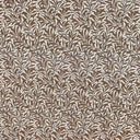 Mönstrat tyg Ramas i brun ton, med tät väv och dekorativt bladmotiv.