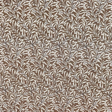 Mönstrat tyg Ramas i brun ton, med tät väv och dekorativt bladmotiv.