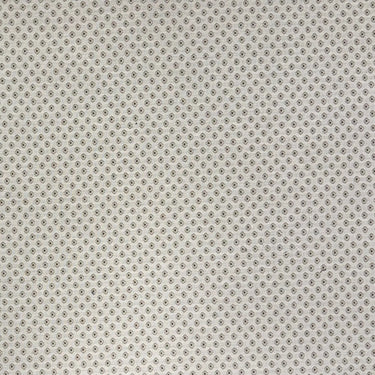 Romeo möbeltyg i ljus naturfärg med små prickiga detaljer. Dubbelvävt och slitstarkt tyg för stoppade möbler och textila projekt.