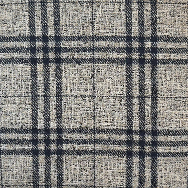 Detaljbild av Coco möbeltyg med tät väv och diskret rutstruktur i naturliga nyanser, anpassat för soffor, kuddar och stoppade möbler.