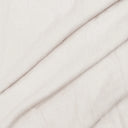 Tvättat linne i 100 % linne i offwhite, mjukt draperat för att visa struktur, tygfall och naturlig linnekaraktär.